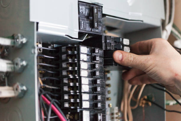 signs-you-need-to-replace-a-circuit-breaker A close-up of a breaker panel showing tripped switches and labels. This photo helps homeowners recognize the warning signs before learning how to replace a circuit breaker.